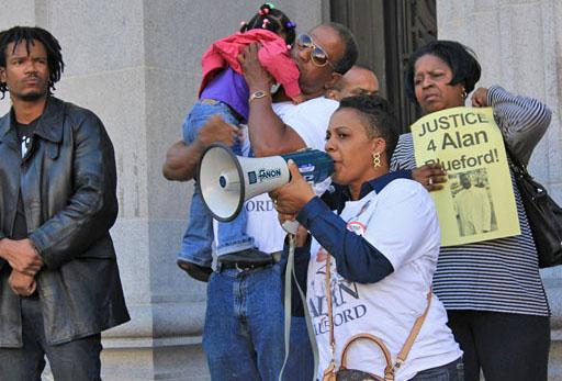 Alan's mother Jeralynn Blueford speaks on the steps of Oakland City Hall